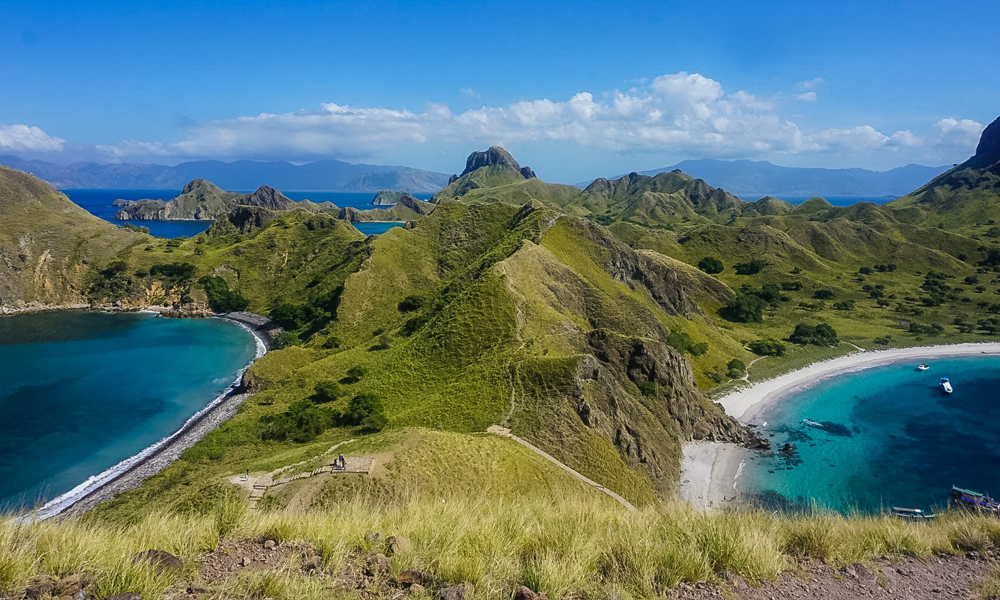 alt="Beautiful centre view of Padar Island in Indonesia showing mountains and beaches on either side"