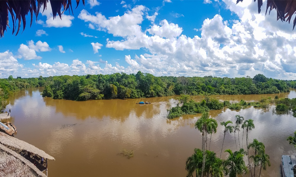 alt=“Amazon Rainforest Lodge view of Amazon river with jungle scenery as a backdrop”