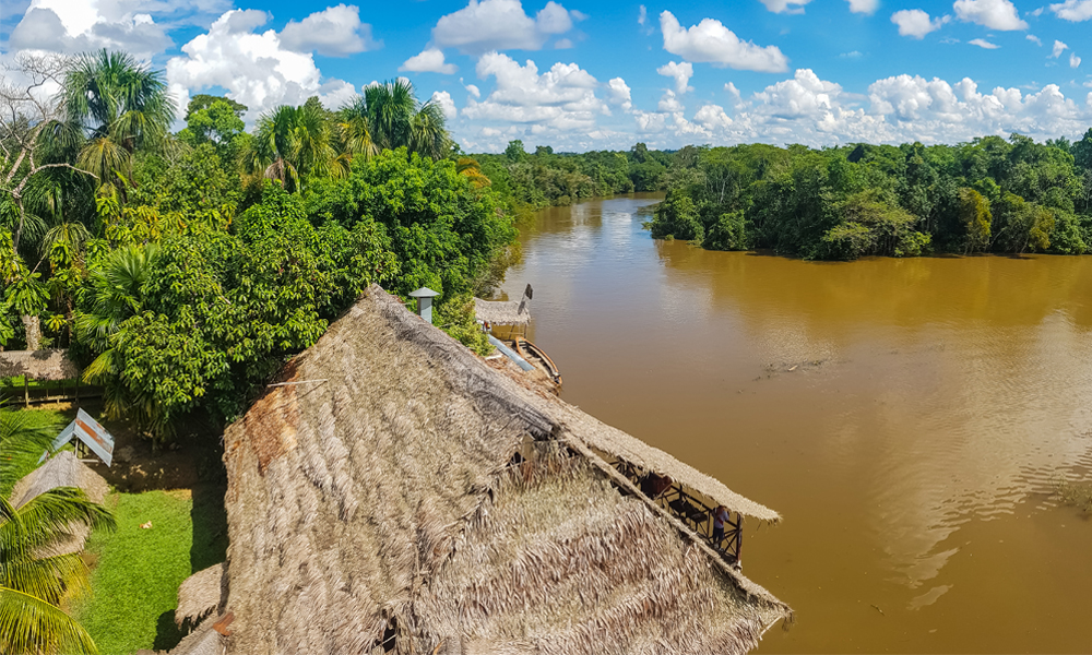 alt=“Amazon Rainforest Lodge view of Amazon river with jungle scenery as a backdrop”