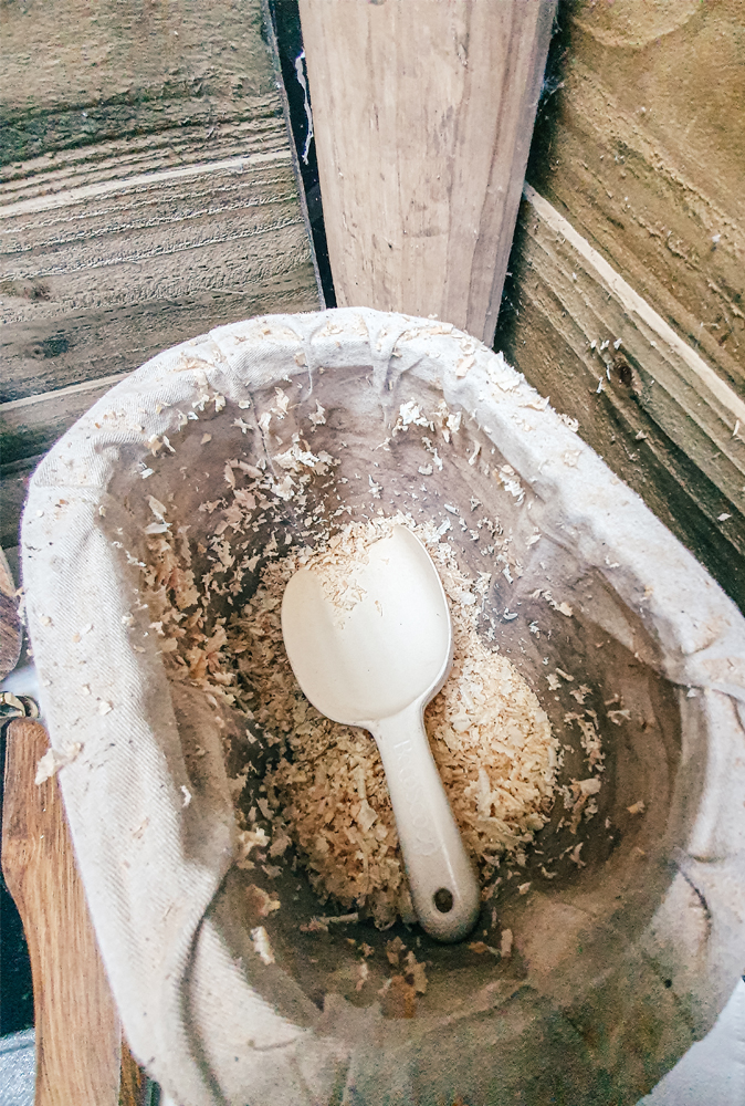 alt=“straw-house-canterbury-compost-toilet-sawdust”